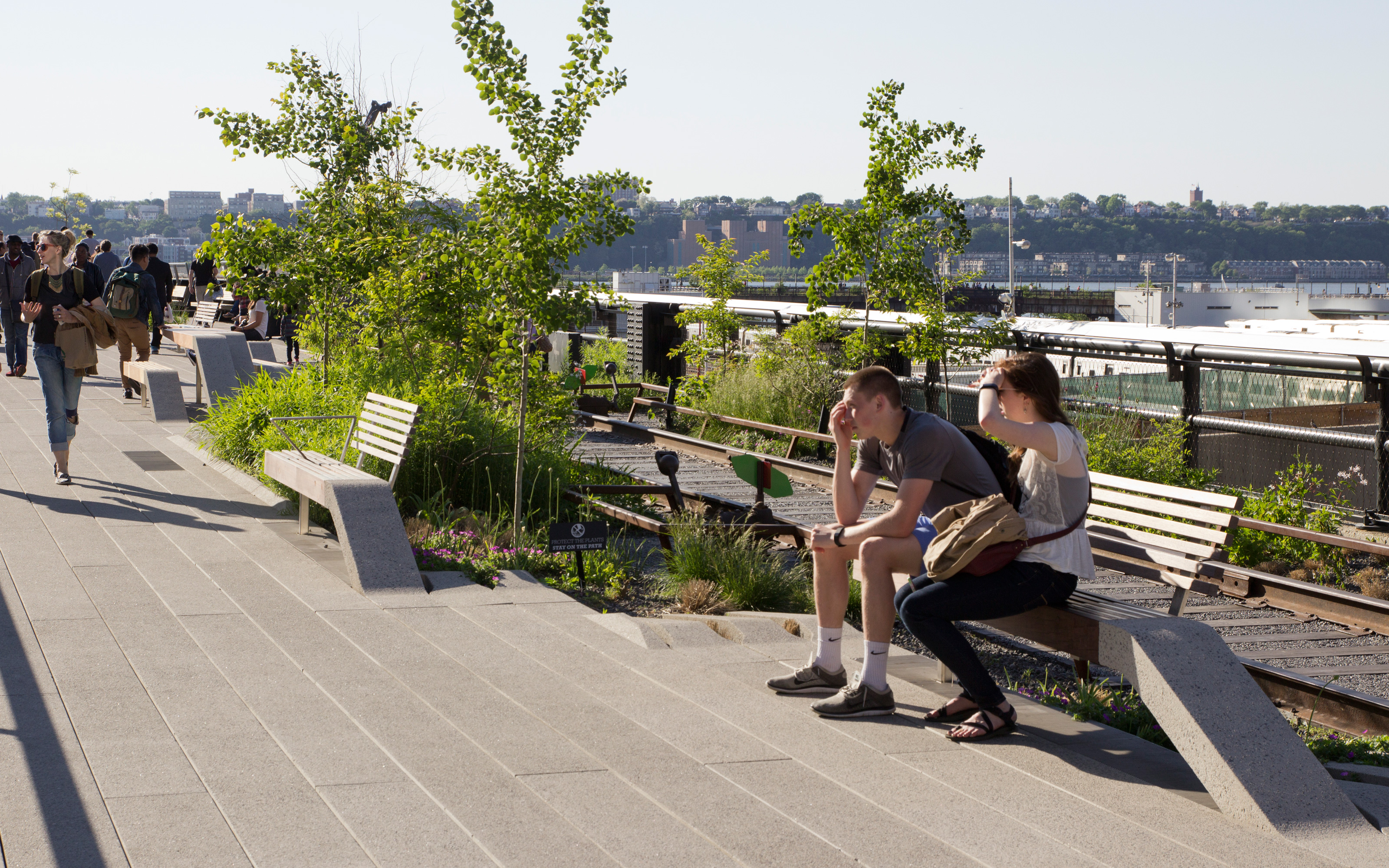 Viewpoints and benches should allow splendid views. Couple sitting on a bench